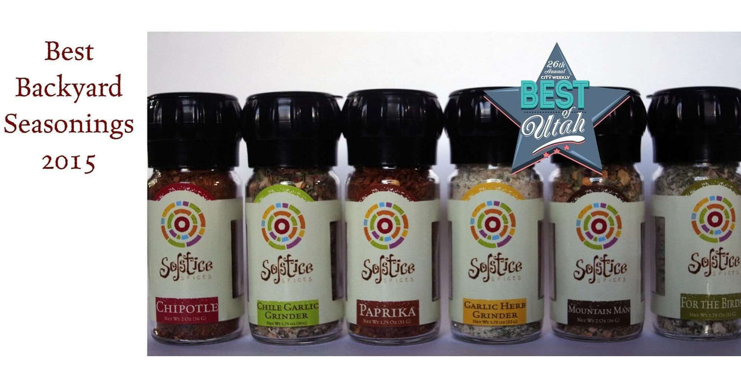 Six jars of Solstice Spices with a City Weekly Best of Utah logo in front. On the white background the words "Best Backyard Seasonings 2015" is printed in red.